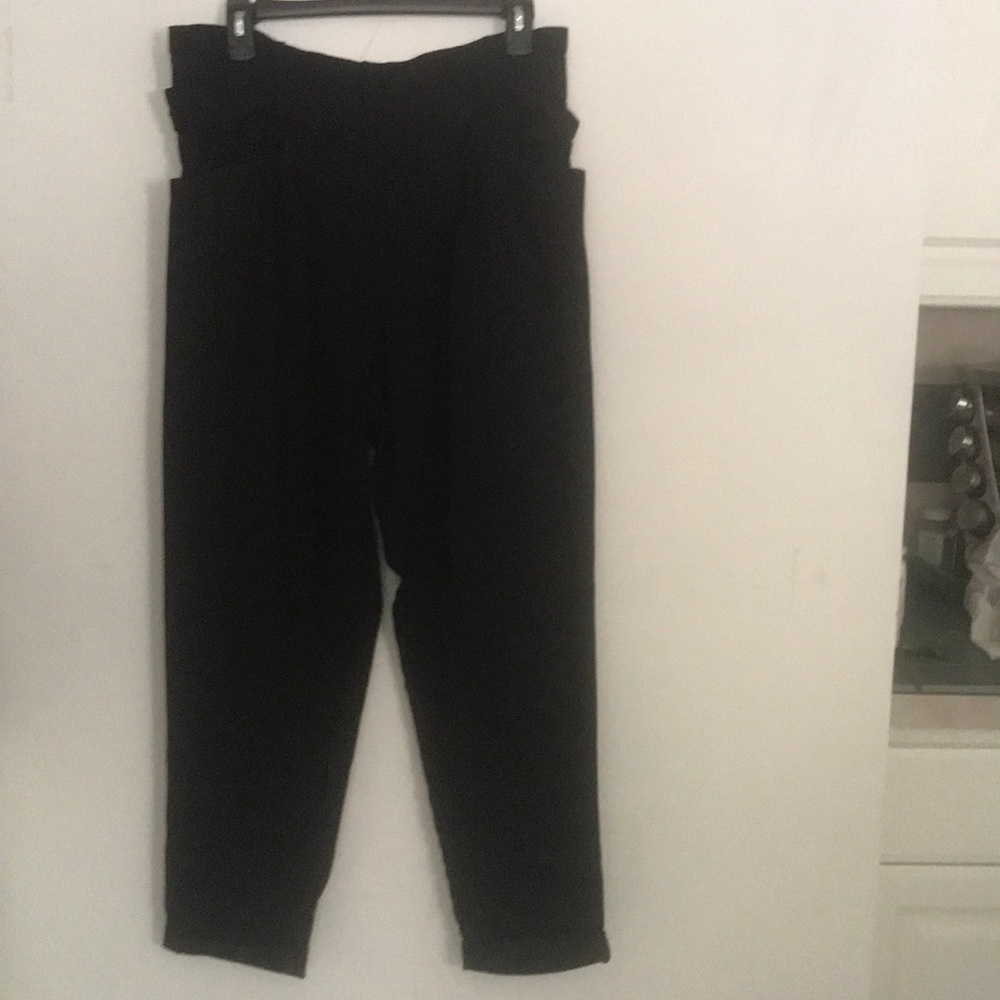 Black fabric pants with belt and two pockets